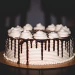 Chocolate cake baking in the oven with a rich, dark texture