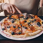 Hot and cheesy Garlic Bread Pizza fresh from the oven with golden garlic bread crust and melted cheese