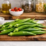 Fresh okra, onions, and Indian spices prepared for crispy bhindi fry recipe.
