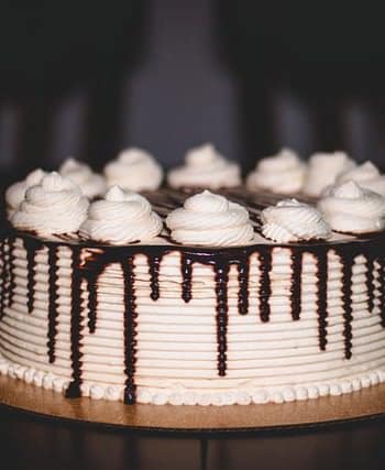 Chocolate cake baking in the oven with a rich, dark texture