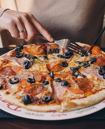 Hot and cheesy Garlic Bread Pizza fresh from the oven with golden garlic bread crust and melted cheese