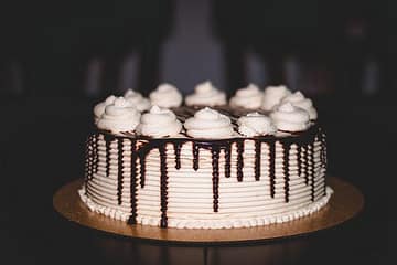 Chocolate cake baking in the oven with a rich, dark texture