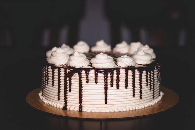Chocolate cake baking in the oven with a rich, dark texture