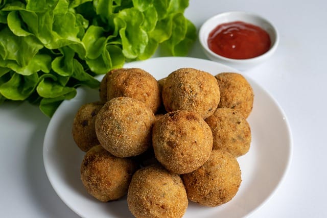 Indian-style veg cutlets served hot with spicy chutney
