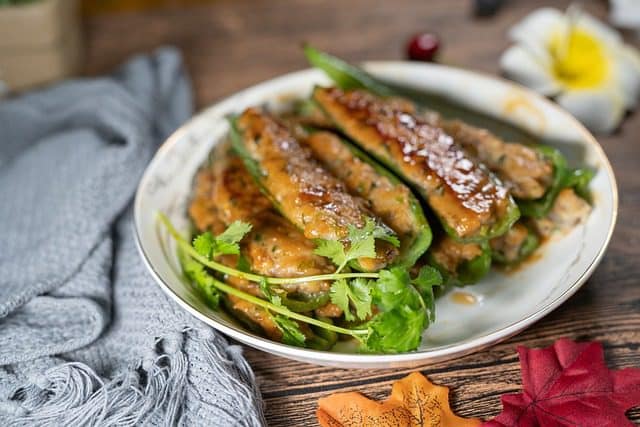 Close-up view of juicy spicy fried fish showing crispy coating and flavorful spices