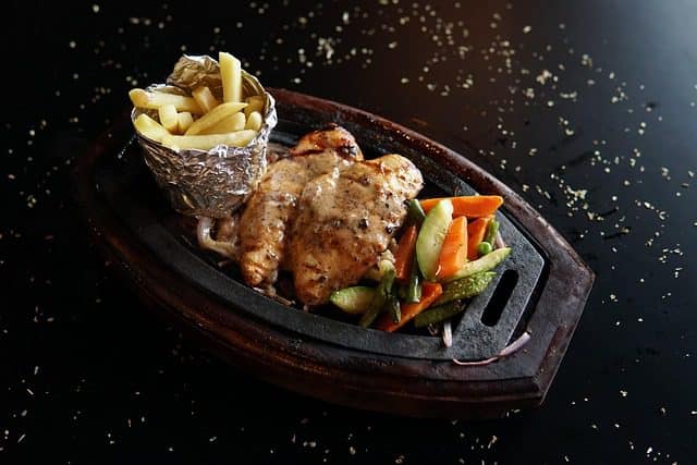 Chicken Tikka served with fresh mint chutney and salad